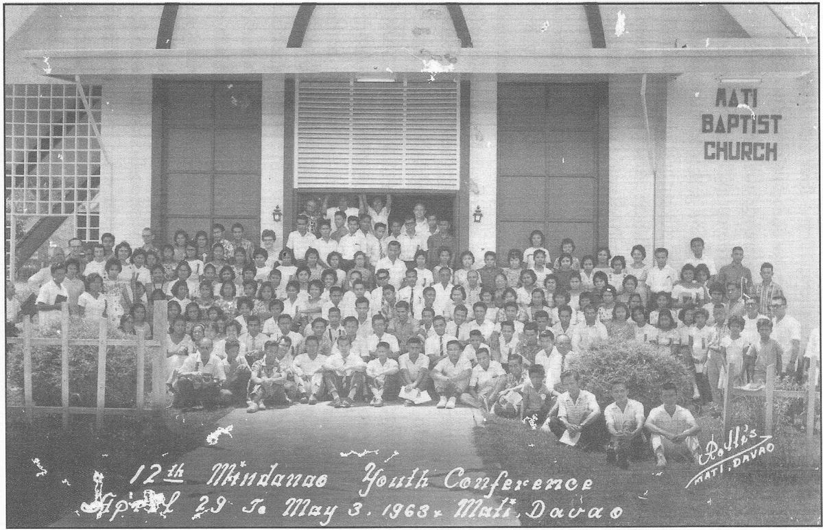 Around two hundred young people gathered on the steps of Mati Baptist Church for a youth conference portrait.